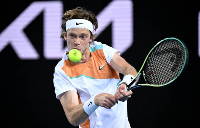 TENNIS AUSTRALIAN OPEN, Andrey Rublev of Russia plays a shot during his third round match against Marin Cilic of Croatia on Day 6 of the Australian Open, at Melbourne Park, in Melbourne, Saturday, January 22, 2022. ( NO ARCHIVING, EDITORIAL USE ONLY, NO USE IN BOOKS WITHOUT CONSENT MELBOURNE VIC AUSTRALIA  Copyright: xDEANxLEWINSx 20220122001615841653
