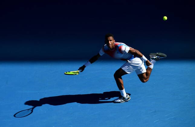 TENNIS AUSTRALIAN OPEN, Felix Auger-Aliassime of Canada in action during his 4th round singles match against Marin Cilic of Croatia on Day 8 of the Australian Open, at Melbourne Park, in Melbourne, Monday, January 24, 2022. ( NO ARCHIVING, EDITORIAL USE ONLY, NO USE IN BOOKS WITHOUT CONSENT MELBOURNE VIC AUSTRALIA  Copyright: xJAMESxROSSx 20220124001616518590