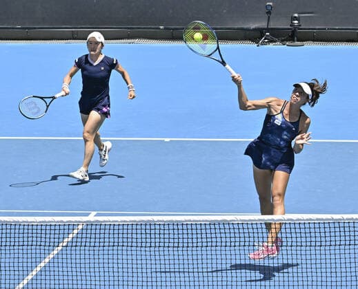 Tennis: Australian Open Ena Shibahara (R) of Japan and Shuko Aoyama of Japan take on Viktoria Kuzmova of Slovakia and Vera Zvonareva of Russia in the third round of the women s doubles at the Australian Open tennis championships in Melbourne on Jan. 24, 2022.  A14AA0001200626P