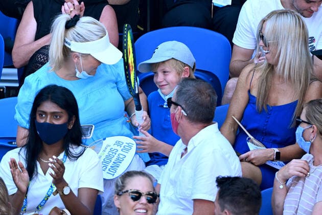 TENNIS AUSTRALIAN OPEN, A child reacts after Nick Kyrgios of Australia gave him his racquet after being hit by a tennis ball, during the Men?s doubles quarterfinal match between Nick Kyrgios and Thanasi Kokkinakis of Australia and Tim Puetz of Germany and Michael Venus of New Zealand on Day 9 of the Australian Open, at Melbourne Park, in Melbourne, Tuesday, January 25, 2022. ( NO ARCHIVING, EDITORIAL USE ONLY, NO USE IN BOOKS WITHOUT CONSENT MELBOURNE VIC AUSTRALIA  Copyright: xDAVExHUNTx 20220125001616820265