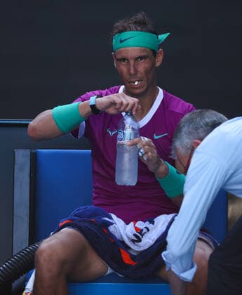 Mandatory Credit: Photo by Ella Ling Shutterstock (12773750eu) Rafael Nadal takes a medical time-out and receives treatment during his quarter-final match Australian Open, Day Nine, Tennis, Melbourne Park, Melbourne, Australia - 25 Jan 2022 Australian Open, Day Nine, Tennis, Melbourne Park, Melbourne, Australia - 25 Jan 2022 Copyright: xEllaxLing Shutterstockx 12773750eu