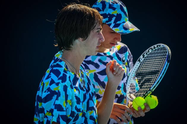 French Gabriel Debru and Swiss Kilian Feldbausch pictured during a second round game in the boys doubles between Belgian Basile Dutch Verbeek and French Debru Swiss Feldbausch at the Australian Open Grand Slam tennis tournament, Tuesday 25 January 2022 in Melbourne Park, Melbourne, Australia. The 2022 edition of the Australian Grand Slam takes place from January 17th to January 30th. PATRICKxHAMILTON  x5500102x