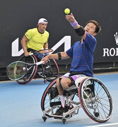 Tennis: Australian Open Shingo Kunieda (front) of Japan and Gustavo Fernandez of Argentina play against Britain s Alfie Hewett and Gordon Reid in the men s wheelchair doubles final at the Australian Open tennis tournament in Melbourne on Jan. 26, 2022.  A14AA0001206583P