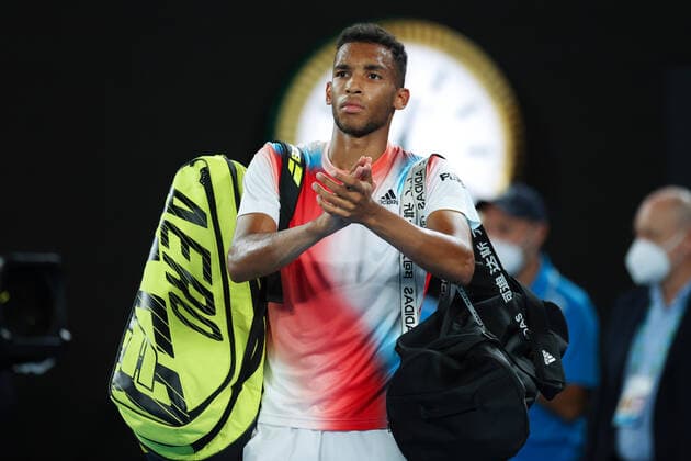 Mandatory Credit: Photo by Ella Ling Shutterstock (12773755fj) Felix Auger-Aliassime after defeat in his quarter final match Australian Open, Day Ten, Tennis, Melbourne Park, Melbourne, Australia - 26 Jan 2022 Australian Open, Day Ten, Tennis, Melbourne Park, Melbourne, Australia - 26 Jan 2022 Copyright: xEllaxLing Shutterstockx 12773755fj