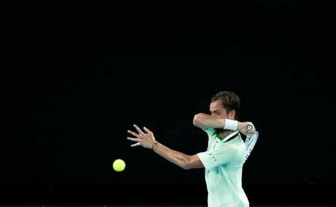 (220126) -- MELBOURNE, Jan. 26, 2022 -- Daniil Medvedev of Russia competes during the men s single match between Felix Auger-Aliassime of Canada and Daniil Medvedev of Russia at Australian Open in Melbourne Park, in Melbourne, Australia, on Jan. 26, 2022. ) (SP)AUSTRALIA-MELBOURNE-TENNIS-AUSTRALIAN OPEN-MEN S SINGLES-QUARTERFINALS BaixXuefei 