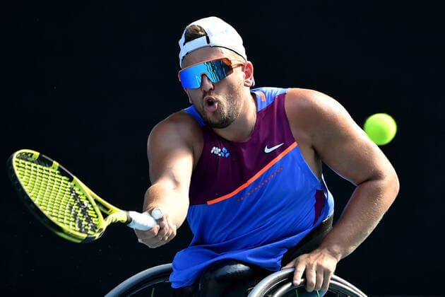 TENNIS AUSTRALIAN OPEN, Dylan Alcott of Australia plays a shot during his Men?s quad wheelchair singles final against Sam Schroder of The Netherlands on Day 11 of the Australian Open, at Melbourne Park, in Melbourne, Thursday, January 27, 2022. ( NO ARCHIVING, EDITORIAL USE ONLY, NO USE IN BOOKS WITHOUT CONSENT MELBOURNE VIC AUSTRALIA  Copyright: xJOELxCARRETTx 20220127001617524580