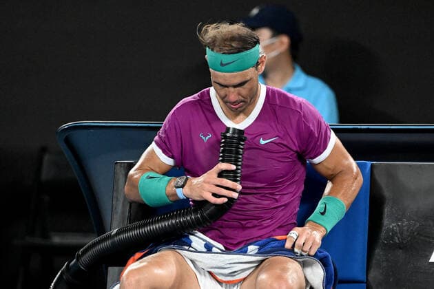 TENNIS AUSTRALIAN OPEN, Rafael Nadal of Spain blows cool air onto himself during his Men?s semifinal match against Matteo Berrettini of Italy on Day 12 of the Australian Open, at Melbourne Park, in Melbourne, Friday, January 28, 2022. ( NO ARCHIVING, EDITORIAL USE ONLY, NO USE IN BOOKS WITHOUT CONSENT MELBOURNE VIC AUSTRALIA  Copyright: xDAVExHUNTx 20220128001617777756