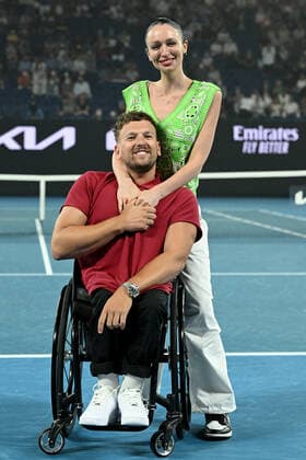 TENNIS AUSTRALIAN OPEN, Australian of the Year Dylan Alcott and his partner Chantell Otten during a presentationfollwoing Alcott?s retirement from competitive tennis, on Day 12 of the Australian Open, at Melbourne Park, in Melbourne, Friday, January 28, 2022. ( NO ARCHIVING, EDITORIAL USE ONLY, NO USE IN BOOKS WITHOUT CONSENT MELBOURNE VIC AUSTRALIA  Copyright: xDAVExHUNTx 20220128001617806107