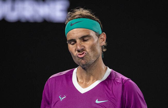 (220128) -- MELBOURNE, Jan. 28, 2022 -- Rafael Nadal of Spain reacts during the men s singles semifinal match between Rafael Nadal of Spain and Matteo Berrettini of Italy at Australian Open in Melbourne Park, in Melbourne, Australia, on Jan. 28, 2022. (Photo by Hu Jingchen Xinhua) (SP)AUSTRALIA-MELBOURNE-TENNIS-AUSTRALIAN OPEN-MEN S SINGLES-SEMIFINALS BaixXuefei 