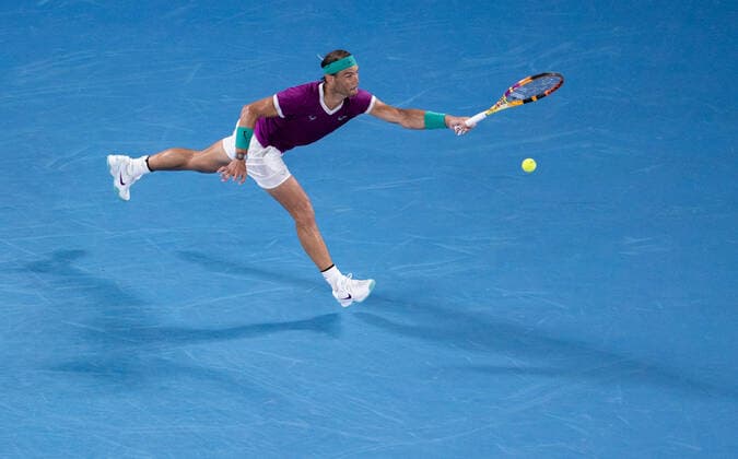 (220128) -- MELBOURNE, Jan. 28, 2022 -- Rafael Nadal of Spain competes during the men s singles semifinal match between Rafael Nadal of Spain and Matteo Berrettini of Italy at Australian Open in Melbourne Park, in Melbourne, Australia, on Jan. 28, 2022. (Photo by Hu Jingchen Xinhua) (SP)AUSTRALIA-MELBOURNE-TENNIS-AUSTRALIAN OPEN-MEN S SINGLES-SEMIFINALS BaixXuefei 