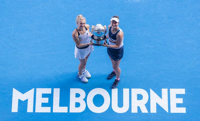 (220130) -- MELBOURNE, Jan. 30, 2022 -- Katerina Siniakova (L) Barbora Krejcikova of the Czech Republic pose for a photo with the trophy after winning the women s doubles final match against Anna Danilina of Kazakhstan Beatriz Haddad Maia of Brazil at Australian Open in Melbourne, Australia, on Jan. 30, 2022. (Photo by Xinhua) (SP)AUSTRALIA-MELBOURNE-TENNIS-AUSTRALIAN OPEN-WOMEN S DOUBLES-FINAL HuxJingchen 
