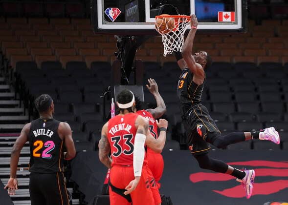 February 1, 2022, TORONTO, ON, CANADA: Miami Heat centre Bam Adebayo (13) slam dunks the ball as Toronto Raptors guard Gary Trent Jr. (33) looks on during first half NBA, Basketball Herren, USA basketball action in Toronto on Tuesday, February 1, 2022. Canada News - February 1, 2022  - ZUMAc35_ 20220201_zaf_c35_099 Copyright: xNathanxDenettex