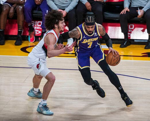 February 2, 2022, Los Angeles, California, USA: Camelo Anthony 7 of the Los Angeles Lakers is defended by CJ Elleby 16 of the Portland Trail Blazers during their NBA, Basketball Herren, USA game on Wednesday February 2, 2022 at Crypto.com Arena in Los Angeles, California. PI Los Angeles USA - ZUMAp124 20220202_zaa_p124_018 Copyright: xJAVIERxROJASx