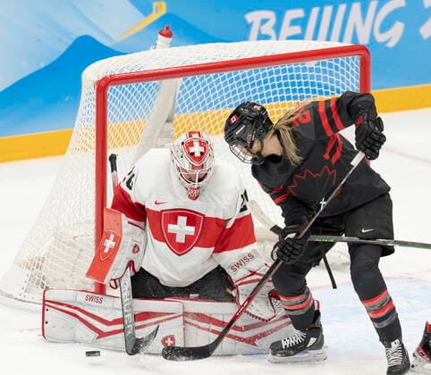 February 3, 2022, Beijing, China: Team Canada forward Natalie Spooner (24) is stopped by Team Switzerland goalkeeper Andrea Braendli (20) during first period women s Ice hockey, Eishockey action Thursday, February 3, 2022 at the 2022 Winter Olympics in Beijing. Natalie Spooner, Andrea Braendli  - ZUMAc35_ 20220203_zaf_c35_017 Copyright: xRyanxRemiorzx