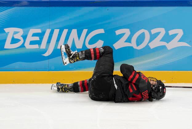 February 3, 2022, Beijing, China: Team Canada forward Melodie Daoust (15) lies on the ice after being injured during second period womenöÄÃ s Ice hockey, Eishockey action against Switzerland Thursday, February 3, 2022 at the 2022 Winter Olympics in Beijing. Melodie Daoust,  - ZUMAc35_ 20220203_zaf_c35_037 Copyright: xRyanxRemiorzx