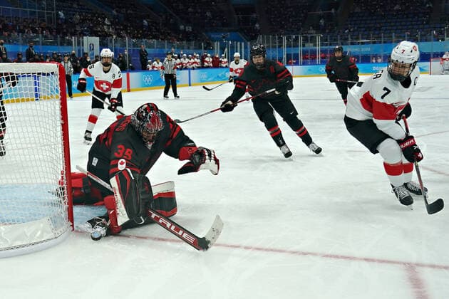 Canadian goalkeeper Ann-Renee Desbiens 35, blocks a shot by Swiss forward Lara Stalder 7, during group A of women s Ice hockey, Eishockey at the National Indoor Stadium in the Winter Olympics in Beijing on Thursday, February 3, 2022. Canada dominated the game winning 12-1.  OLY20220203004 RICHARDxELLIS