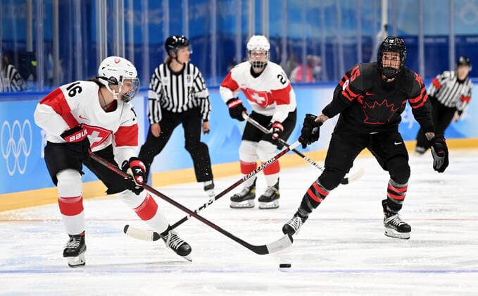 (220203) -- BEIJING, Feb. 3, 2022 -- Melodie Daoust (2nd R) of Canada vies with Nicole Vallario of Switzerland during the women s Ice hockey, Eishockey preliminary round Group A match between Canada and Switzerland at National Indoor Stadium in Beijing, China, Feb. 3, 2022. ) (BEIJING2022)CHINA-BEIJING-OLYMPIC Winter games, Winterspiele,Spiele, Summer games ICE HOCKEY-WOMEN S PRELIMINARY?(CN) LixZiheng 