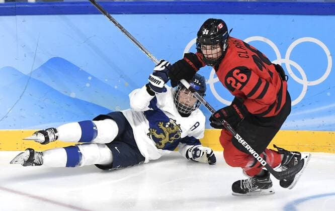 Michelle Karvinen of Finland and Emily Clark of Canada during women s Ice hockey, Eishockey preliminary round group A match between Finland and Canada at the Beijing Winter Olympic Games, Olympische Spiele, Olympia, OS in Wukesong Sports Centre in Beijing on February 5, 2022. Beijing China LKLAPJ20220205062350L932  Copyright: xJussixNukarix