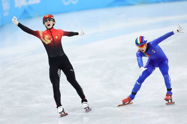 (220205) -- BEIJING, Feb. 5, 2022 -- Wu Dajing (L) of China celebrates after crossing the finishing line during the mixed team relay final of short track Speed skating, Eisschnelllauf at Capital Indoor Stadium in Beijing, China, Feb. 5, 2022. ) (BEIJING 2022)CHINA-BEIJING-OLYMPIC Winter games, Winterspiele,Spiele, Summer games SHORT TRACK SPEED SKATING (CN) LanxHongguang 