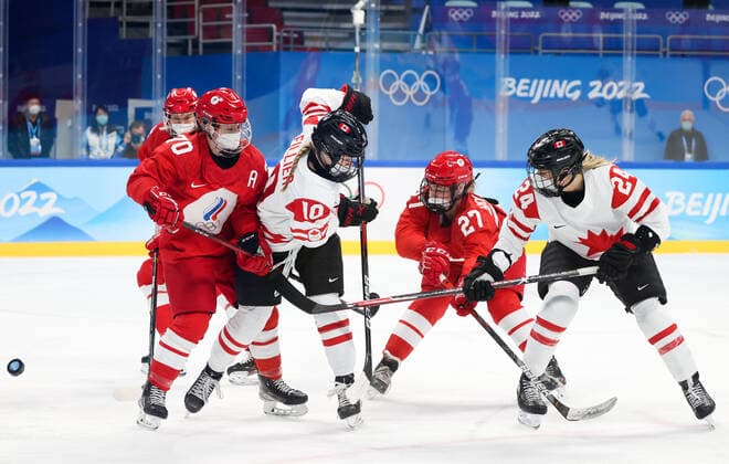BEIJING, CHINA - FEBRUARY 7, 2022: Anna Shibanova of the ROC Team, Sarah Fillier of Canada, Veronika Korzhakova of the ROC Team and Natalie Spooner (L-R) of Canada fight for the puck in their women s Group A Ice hockey, Eishockey match at the 2022 Winter Olympic Games, Olympische Spiele, Olympia, OS at the Wukesong Sports Centre. Anton Novoderezhkin TASS  TS121AFD