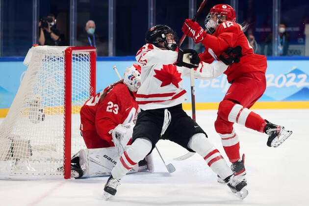 BEIJING, CHINA - FEBRUARY 7, 2022: Goalie Daria Gredzen of the ROC Team, Marie-Philip Poulin of Canada and Maria Pechnikova (L-R) of the ROC Team are in action in their women s Group A Ice hockey, Eishockey match at the 2022 Winter Olympic Games, Olympische Spiele, Olympia, OS at the Wukesong Sports Centre. Anton Novoderezhkin TASS  TS121B0D