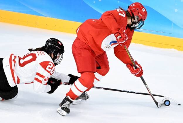 China Olympics 2022 Ice hockey, Eishockey Women ROC - Canada 8106733 07.02.2022 Canada s Sarah Nurse, left, and Russian Olympic Committee s Veronika Korzhakova struggle for a puck in the ice hockey women s preliminary round group A match between the Russian Olympic Committee s team and Canada during the Beijing 2022 Winter Olympic Games, Olympische Spiele, Olympia, OS at Wukesong Sports Centre in Beijing, China. Vladimir Astapkovich Sputnik Beijing China  Copyright: xVladimirxAstapkovichx