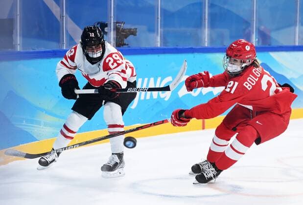 China Olympics 2022 Ice hockey, Eishockey Women ROC - Canada 8106731 07.02.2022 Canada s Marie-Philip Poulin, left, and Russian Olympic Committee s Polina Bolgareva struggle for a puck in the ice hockey women s preliminary round group A match between the Russian Olympic Committee s team and Canada during the Beijing 2022 Winter Olympic Games, Olympische Spiele, Olympia, OS at Wukesong Sports Centre in Beijing, China. Vladimir Astapkovich Sputnik Beijing China  Copyright: xVladimirxAstapkovichx