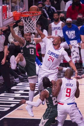 February 6, 2022, Los Angeles, California, USA: Norman Powell, 24 of the Los Angeles Clippers scores, going past Jordan Nwora 13 of the Milwaukee Bucks during their NBA, Basketball Herren, USA game on Sunday February 6, 2022 at Crypto.com Arena in Los Angeles, California. Clippers lose to Bucks, 113-137. ARIANA RUIZ PI Los Angeles USA - ZUMAp124 20220206_zaa_p124_054 Copyright: xArianaxRuizx