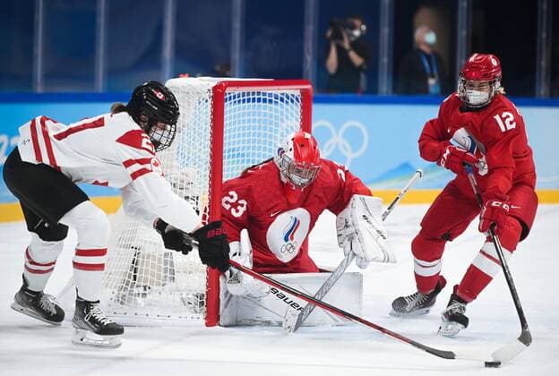 China Olympics 2022 Ice hockey, Eishockey Women ROC - Canada 8106781 07.02.2022 From left, Canada s Ashton Bell, Russian Olympic Committee s goaltender Daria Gredzen and Russian Olympic Committee s Maria Pechnikova struggle for a puck in the ice hockey women s preliminary round group A match between the Russian Olympic Committee s team and Canada during the Beijing 2022 Winter Olympic Games, Olympische Spiele, Olympia, OS at Wukesong Sports Centre in Beijing, China. Vladimir Astapkovich Sputnik Beijing China  Copyright: xVladimirxAstapkovichx