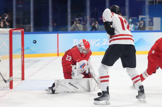 BEIJING, CHINA - FEBRUARY 7, 2022: Brianne Jenner (R) of Canada scores past goalie Daria Gredzen of the ROC Team in their women s Group A Ice hockey, Eishockey match at the 2022 Winter Olympic Games, Olympische Spiele, Olympia, OS at the Wukesong Sports Centre. Anton Novoderezhkin TASS  TS121B61