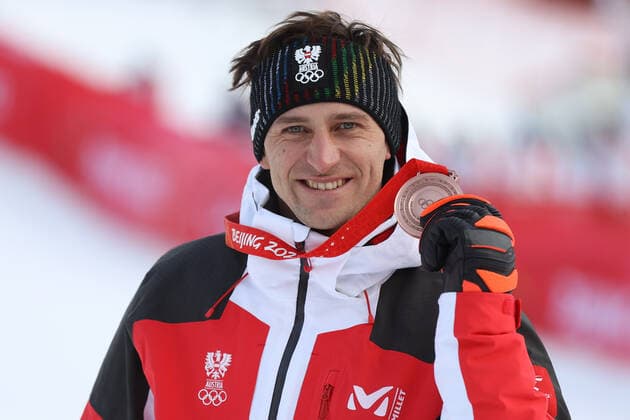OLYMPICS - Winter Olympic Games, Olympische Spiele, Olympia, OS Beijing 2022 YANQING,CHINA,07.FEB.22 - OLYMPICS, ALPINE SKIING - Winter Olympic Games Beijing 2022, downhill, men, award ceremony. Image shows the rejoicing of Matthias Mayer (AUT). keywords: medal.  GEPAxpictures xHaraldxSteiner