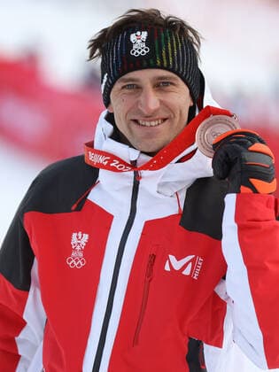 OLYMPICS - Winter Olympic Games, Olympische Spiele, Olympia, OS Beijing 2022 YANQING,CHINA,07.FEB.22 - OLYMPICS, ALPINE SKIING - Winter Olympic Games Beijing 2022, downhill, men, award ceremony. Image shows the rejoicing of Matthias Mayer (AUT). keywords: medal.  GEPAxpictures xHaraldxSteiner