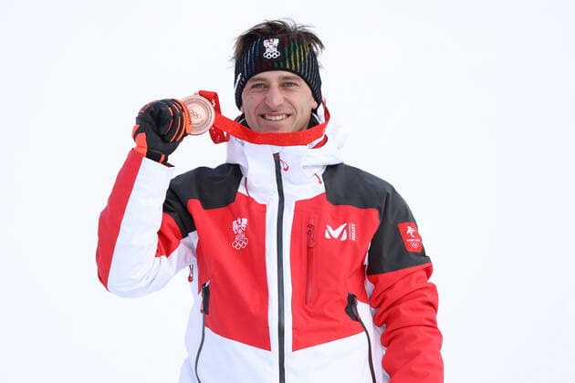 OLYMPICS - Winter Olympic Games, Olympische Spiele, Olympia, OS Beijing 2022 YANQING,CHINA,07.FEB.22 - OLYMPICS, ALPINE SKIING - Winter Olympic Games Beijing 2022, downhill, men, award ceremony. Image shows the rejoicing of Matthias Mayer (AUT). keywords: medal.  GEPAxpictures xHaraldxSteiner
