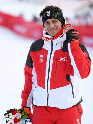 OLYMPICS - Winter Olympic Games, Olympische Spiele, Olympia, OS Beijing 2022 YANQING,CHINA,07.FEB.22 - OLYMPICS, ALPINE SKIING - Winter Olympic Games Beijing 2022, downhill, men, award ceremony. Image shows the rejoicing of Matthias Mayer (AUT). keywords: medal.  GEPAxpictures xHaraldxSteiner
