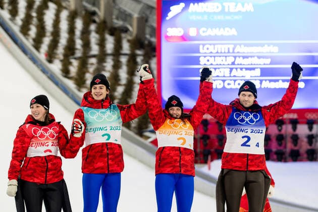 OLYMPICS - Winter Olympic Games, Olympische Spiele, Olympia, OS Beijing 2022 ZHANGJIAKOU,CHINA,07.FEB.22 - OLYMPICS, NORDIC SKIING, Ski jumping, Skispringen, Ski, nordisch - Winter Olympic Games Beijing 2022, normal hill, mixed team event. Image shows the rejoicing of Alexandria Loutitt, Matthew Soukup, Abigail Strate and Mackenzie BoydClowes (CAN). GEPAxpictures xMaticxKlansek