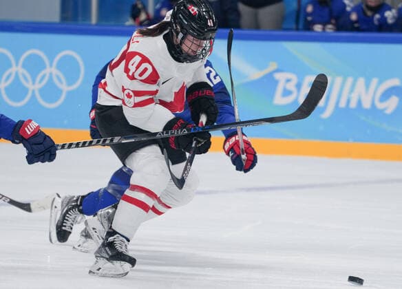 (220208) -- BEIJING, Feb. 8, 2022 -- Blayre Turnbull (front) of Canada controls the puck during the Ice hockey, Eishockey women s preliminary round group A match between Canada and the United States at Wukesong Sports Centre in Beijing, capital of China, Feb. 8, 2022. ) (BEIJING2022)CHINA-BEIJING-OLYMPIC Winter games, Winterspiele,Spiele, Summer games ICE HOCKEY-WOMEN S PRELIMINARY-CANADA VS U.S. (CN) DuxYu 