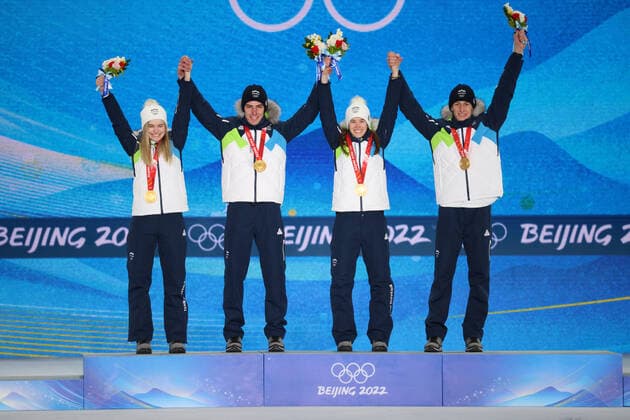 OLYMPICS - Winter Olympic Games, Olympische Spiele, Olympia, OS Beijing 2022 ZHANGJIAKOU,CHINA,08.FEB.22 - OLYMPICS, NORDIC SKIING, Ski jumping, Skispringen, Ski, nordisch - Winter Olympic Games Beijing 2022, normal hill, mixed team event, award ceremony. Image shows the rejoicing of Nika Kriznar, Timi Zajc, Ursa Bogataj and Peter Prevc (SLO). keywords: medal. GEPAxpictures xMaticxKlansek