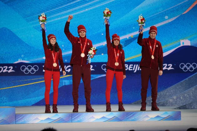 OLYMPICS - Winter Olympic Games, Olympische Spiele, Olympia, OS Beijing 2022 ZHANGJIAKOU,CHINA,08.FEB.22 - OLYMPICS, NORDIC SKIING, Ski jumping, Skispringen, Ski, nordisch - Winter Olympic Games Beijing 2022, normal hill, mixed team event, award ceremony. Image shows the rejoicing of Alexandria Loutitt, Matthew Soukup, Abigail Strate and Mackenzie Boyd-Clowes (CAN). keywords: medal. GEPAxpictures xMaticxKlansek