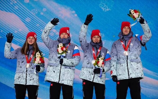 China Olympics 2022 Medal Ceremony 8108137 08.02.2022 Silver medalists Russian Olympic Committee s Irma Makhinia, Danil Sadreev, Irina Avvakumova, Evgeniy Klimov celebrates on the podium during the medal ceremony for the Ski jumping, Skispringen, Ski, nordisch mixed team event of the Beijing 2022 Winter Olympic Games, Olympische Spiele, Olympia, OS at the Medals Plaza in Zhangjiakou, China. Ramil Sitdikov Sputnik Beijing China Copyright: xRamilxSitdikovx