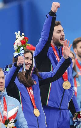 (220208) -- BEIJING, Feb. 8, 2022 -- Gold Medalist Stefania Constantini (L) of Italy and her teammate Amos Mosaner celebrate during the awarding ceremony after the curling mixed doubles gold medal game of the Beijing 2022 Winter Olympics between Italy and Norway at the National Aquatics Centre in Beijing, capital of China, Feb. 8, 2022. ) (BEIJING2022)CHINA-BEIJING-WINTER Olympic Games, Olympische Spiele, Olympia, OS CURLING-MIXED DOUBLES-GOLD MEDAL GAME-ITALY VS NORWAY(CN) LiuxXu 
