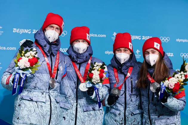 ZHANGJIAKOU, CHINA - FEBRUARY 8, 2022: Silver medallists Irma Makhinya, Danil Sadreyev, Irina Avvakumova and Yevgeny Klimov of Team ROC (L-R) show their medals during the victory ceremony for the mixed team normal hill (NH) final at the Medal Plaza at the 2022 Winter Olympic Games, Olympische Spiele, Olympia, OS Russian Olympic Committee TASS THIS IMAGE WAS PROVIDED BY A THIRD PARTY. EDITORIAL USE ONLY  TS121F7A