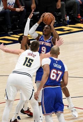 New York Knicks guard RJ Barrett 9, center right, goes up for a shot against Denver Nuggets center Nikola Jokic 15, center left, and Denver Nuggets guard Monte Morris 11, left, as New York Knicks center Taj Gibson 67, right looks on during the first quarter at the Ball Arena in Denver, CO, USA, 08 February 2022. EPA Todd Pierson Denver Nuggets - New York Knicks !ACHTUNG: NUR REDAKTIONELLE NUTZUNG!  Copyright: xToddxPiersonx AME4545 20220209-01f39052d0250a7b1ac9693999859d014ab9c7d6
