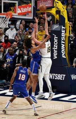 Denver Nuggets center Nikola Jokic 15, right, goes up for a basket against New York Knicks forward Jericho Sims 45, center, as New York Knicks guard Alec Burks 18, left, looks on during the first quarter at the Ball Arena in Denver, CO, USA, 08 February 2022. Denver Nuggets - New York Knicks !ACHTUNG: NUR REDAKTIONELLE NUTZUNG!  Copyright: xToddxPiersonx AME4553 20220209-97a4c1921b0e1ca7cf8b07df8099fa9c4f097d13