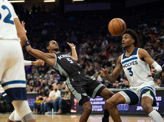 February 9, 2022, Sacramento, CA, USA: Sacramento Kings guard De Aaron Fox (5) is fouled by Minnesota Timberwolves guard D Angelo Russell (0) in the second quarter during a game at Golden 1 Center on Wednesday, Feb. 9, 2022 in Sacramento. Sacramento USA - ZUMAj89_ 20220209_zaf_j89_023 Copyright: xPaulxKitagakixJr.x