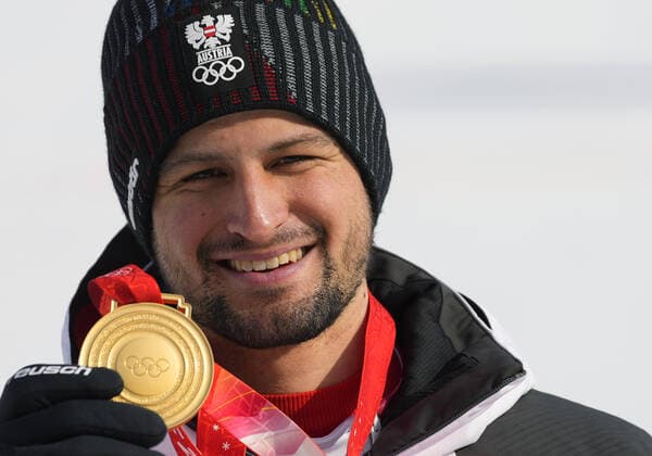 Johannes Strolz of Austria poses with the gold medal in the men s Alpine Combined at the Winter Olympics in Beijing on Thursday February 10, 2022.  OLY20220210414 RICKxTxWILKING