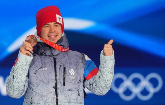 China Olympics 2022 Medal Ceremony 8110341 10.02.2022 Bronze medalist Russian Olympic Committee s Semen Elistratov poses on the podium during the medal ceremony for the men s 1500 m short track Speed skating, Eisschnelllauf event of the Beijing 2022 Winter Olympic Games, Olympische Spiele, Olympia, OS at the Medals Plaza in Beijing, China. Alexander Vilf Sputnik Beijing China  Copyright: xAlexanderxVilfx