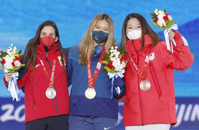 Beijing Olympics: Snowboard (from left) Silver medalist Queralt Castellet of Spain, gold medalist Chloe Kim of the United States and bronze medalist Sena Tomita of Japan pose during the medal ceremony for the women s snowboard halfpipe at the Beijing Winter Olympics on Feb. 10, 2022, in Zhangjiakou, China.  A14AA0001238196P