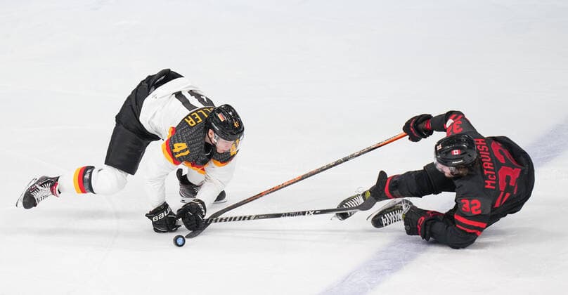 (220210) -- BEIJING, Feb. 10, 2022 -- Mason McTavish (R) of Canada vies with Jonas Muller of Germany during Ice hockey, Eishockey men s Group A match between Canada and Germany at Wukesong Sports Centre in Beijing, capital of China, Feb. 10, 2022. ) (BEIJING2022)CHINA-BEIJING-OLYMPIC Winter games, Winterspiele,Spiele, Summer games ICE HOCKEY-MEN S PRELIMINARY-CANADA VS GERMANY (CN) MengxYongmin 