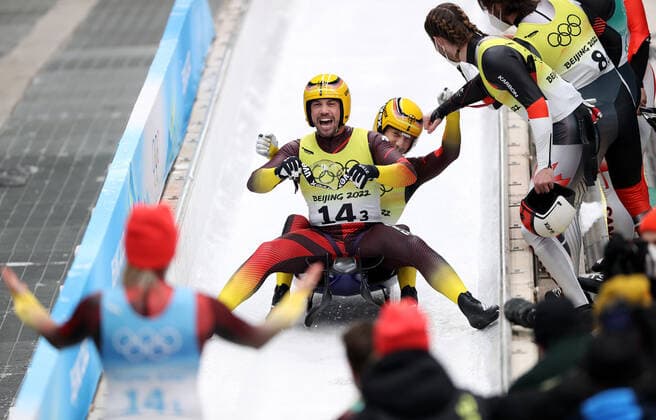 (220210) -- BEIJING, Feb. 10, 2022 -- Tobias Wendl Tobias Arlt of Germany celebrate after the luge team relay competition at the Yanqing National Sliding Centre in Yanqing district of Beijing, capital of China, Feb. 10, 2022. ) (BEIJING2022)CHINA-BEIJING-YANQING-OLYMPIC Winter games, Winterspiele,Spiele, Summer games LUGE-TEAM RELAY (CN) YaoxJianfeng 
