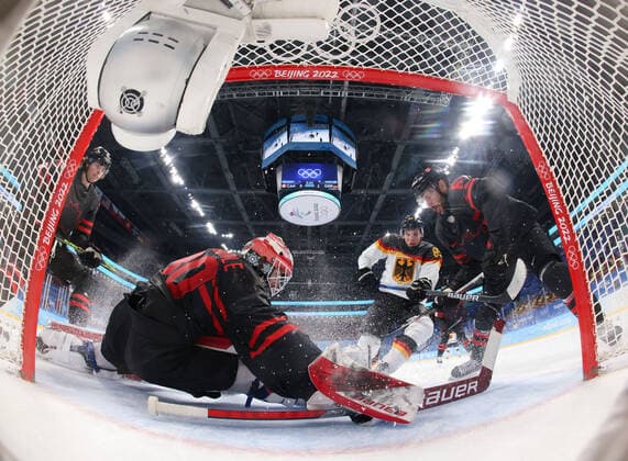 (220210) -- BEIJING, Feb. 10, 2022 -- Goalkeeper Eddie Pasquale (front) of Canada tries to make a save during Ice hockey, Eishockey men s Group A match between Canada and Germany at Wukesong Sports Centre in Beijing, capital of China, Feb. 10, 2022. Song Yanhua) (BEIJING2022)CHINA-BEIJING-OLYMPIC Winter games, Winterspiele,Spiele, Summer games ICE HOCKEY-MEN S PRELIMINARY-CANADA VS GERMANY (CN) RemotexCamera 